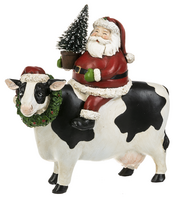 Santa on Cow Figurine